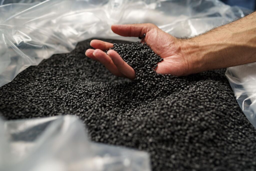 th_close-up-of-male-hand-holding-plastic-polymer-gran-2021-09-04-08-54-26-utc